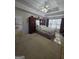 Carpeted bedroom with large closet, windows and neutral walls and large area rug at 5725 Lake Windsor Pkwy, Buford, GA 30518