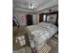 Bedroom with a large bed, mirrored closet, and sunlit flooring at 5725 Lake Windsor Pkwy, Buford, GA 30518