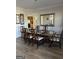 Elegant dining room featuring a chandelier, mirror, and views into the kitchen at 5725 Lake Windsor Pkwy, Buford, GA 30518