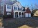 Charming two-story home with a brick and siding exterior, complemented by a cozy front porch at 5725 Lake Windsor Pkwy, Buford, GA 30518