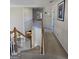 Upstairs hallway shows the railing overlooking the living room, and carpeted floors at 5725 Lake Windsor Pkwy, Buford, GA 30518