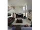 Spacious living room features a fireplace, large windows, and comfortable seating at 5725 Lake Windsor Pkwy, Buford, GA 30518