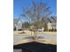 Street view of a peaceful suburban neighborhood with well-maintained lawns and diverse home styles at 5725 Lake Windsor Pkwy, Buford, GA 30518