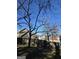 View of neighboring homes from behind a home's backyard wooden fence at 5725 Lake Windsor Pkwy, Buford, GA 30518