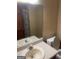 Bathroom featuring a vanity, sink, mirror and toilet at 392 Hwy 314, Fayetteville, GA 30214