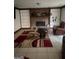 Cozy living room with a fireplace, built-in bookshelves, and a comfortable seating area at 392 Hwy 314, Fayetteville, GA 30214