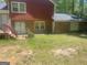 Backyard featuring a small deck and a partial brick exterior at 392 N Hwy 314, Fayetteville, GA 30214