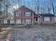 Charming two-story home featuring brick accents, blue shutters, and a well-maintained front yard at 392 N Hwy 314, Fayetteville, GA 30214