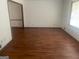 Open living room with gleaming hardwood floors and natural light at 392 N Hwy 314, Fayetteville, GA 30214