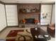 Inviting living room featuring a brick fireplace with built-in bookshelves at 392 N Hwy 314, Fayetteville, GA 30214
