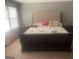 Main bedroom featuring a large bed, side tables and natural light at 392 N Hwy 314, Fayetteville, GA 30214