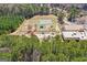 Aerial view of the neighborhood school with a playground and sports field at 62 Cobblestone Crk, Peachtree City, GA 30269