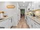 Bright kitchen features stainless steel appliances, granite countertops, and an open view to the next room at 62 Cobblestone Crk, Peachtree City, GA 30269