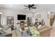 Comfortable living room with modern decor, a ceiling fan, and plush seating at 62 Cobblestone Crk, Peachtree City, GA 30269