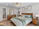 Serene main bedroom with a king-size bed, wood furniture, and soft decor at 62 Cobblestone Crk, Peachtree City, GA 30269