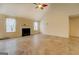 Spacious living room featuring a fireplace, high ceilings, tile floors, and natural light from large windows at 477 Harvick Cir, Stockbridge, GA 30281