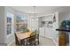 A dining area with a built-in laundry room with a washer and dryer and lots of natural light at 520 Easton Dr, Locust Grove, GA 30248