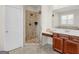 Bathroom featuring a glass enclosed shower with tile surround, a vanity, and tiled flooring at 109 Faversham Dr, Mcdonough, GA 30252