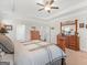 Spacious main bedroom with a tray ceiling, and matching wooden dressers on either side at 109 Faversham Dr, Mcdonough, GA 30252