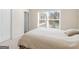Bright bedroom with carpet, a large window with blinds, and neutral wall color at 109 Faversham Dr, Mcdonough, GA 30252