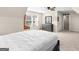 Bright bedroom featuring sloped ceilings, carpet, and a wooden dresser with mirror at 109 Faversham Dr, Mcdonough, GA 30252