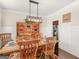 Dining room featuring a wooden table, a hutch, and comfortable chairs at 109 Faversham Dr, Mcdonough, GA 30252