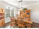 Cozy dining room featuring wood table, comfortable seating, and a decorative hutch at 109 Faversham Dr, Mcdonough, GA 30252