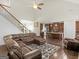 Spacious living room open to the kitchen, featuring hardwood floors and modern decor at 109 Faversham Dr, Mcdonough, GA 30252