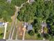 Birds-eye view of the property highlighting the home's roof and the tree-lined neighborhood at 1293 Coan Dr, Locust Grove, GA 30248