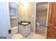 Classic bathroom features a functional vanity and mirror next to an entry to the tiled shower at 250 Devilla Trce, Fayetteville, GA 30214
