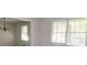 Cozy dining room features a classic chandelier and ample natural light at 250 Devilla Trce, Fayetteville, GA 30214