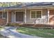 Welcoming home entrance with a double front door, brick accents, and mature landscaping at 250 Devilla Trce, Fayetteville, GA 30214