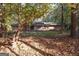 Lovely single-story home surrounded by mature trees and lush landscaping at 250 Devilla Trce, Fayetteville, GA 30214