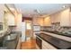 Traditional eat-in kitchen features granite countertops, stainless appliances, and light wood cabinets at 250 Devilla Trce, Fayetteville, GA 30214