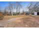 Wide open backyard featuring gravel area and partially fenced yard at 2827 Somerton Dr, Morrow, GA 30260