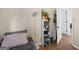 Bedroom with laminate wood flooring, a standing shelf and closet with open doorway at 2827 Somerton Dr, Morrow, GA 30260