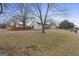 Exterior of home featuring mature trees and a large yard at 2827 Somerton Dr, Morrow, GA 30260