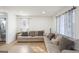 Bright and airy living room features stylish laminate floors and comfortable seating at 2827 Somerton Dr, Morrow, GA 30260