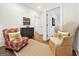 Hallway with seating, neutral walls, and access to the other living areas at 9135 Selborne Ln, Chattahoochee Hills, GA 30268