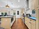 Modern kitchen showcasing custom cabinetry, stainless steel appliances, and a sleek countertop at 9135 Selborne Ln, Chattahoochee Hills, GA 30268