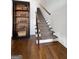 Elegant staircase with hardwood floors and white risers at 9135 Selborne Ln, Chattahoochee Hills, GA 30268