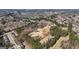 An aerial shot shows the property nestled among lush trees, offering a tranquil setting and ample privacy at 3630 Jim Moore Rd, Dacula, GA 30019
