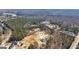 This aerial shot features the wooded property near the road, ready for your dream home at 3630 Jim Moore Rd, Dacula, GA 30019
