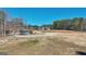 Expansive lot featuring a home with a large cleared area ready for development at 3630 Jim Moore Rd, Dacula, GA 30019