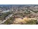 Aerial view showcasing the community with a lake, surrounded by mature trees and scenic views at 3630 Jim Moore Rd, Dacula, GA 30019