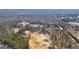 This aerial perspective highlights the homesite, surrounded by mature trees in a peaceful community at 3630 Jim Moore Rd, Dacula, GA 30019