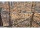Rope railing of a viewing deck in a lush, wooded setting at 3630 Jim Moore Rd, Dacula, GA 30019