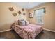 Cozy bedroom featuring natural light from a bright window and decorative wall hangings at 170 Cobblestone Ct, Douglasville, GA 30134