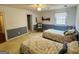 This well-lit bedroom has two beds, half wall, a window and an ensuite bathroom view at 9255 Betony Wood Trl, Jonesboro, GA 30236