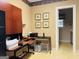 A home office featuring a desk, printer, and view into another room of the house at 9255 Betony Wood Trl, Jonesboro, GA 30236